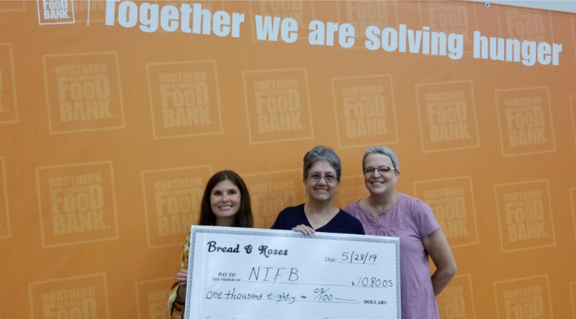 giving 1 Bread & Roses presenting concert proceeds donation