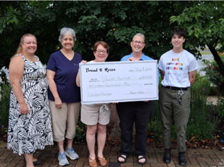 giving 2925 youth outlook Bread & Roses presents concert proceeds donation to Youth Outlook June 2025